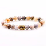 Bracelets multi couleurs en pierres naturelles d’Onyx et tête de Bouddha