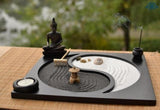 Jardin japonais zen avec galets et bougies